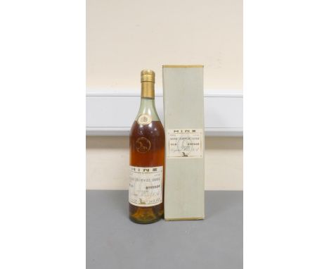 A 1960s Hine Grande Champagne Cognac complete with carton. 24FLoz 70cl 70° proof 40% ABV.