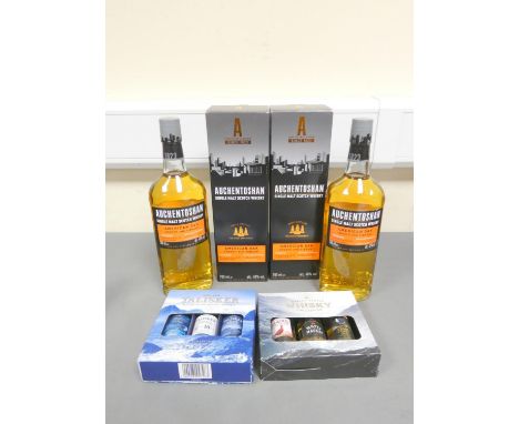Auchentoshan lowland American oak single malt scotch whisky, 70cl, 40% vol, and another, with a Talisker three miniature bott
