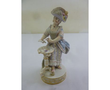 Meissen figurine of a lady in classical dress playing cards, marks to the base