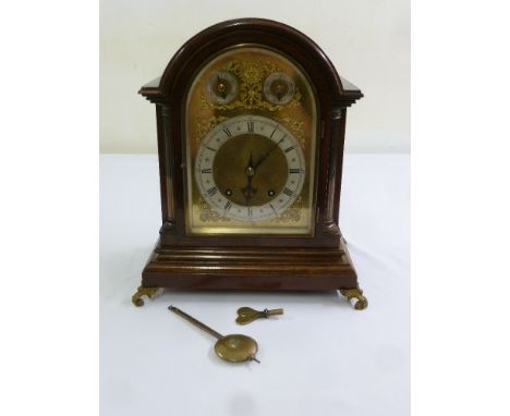A Victorian mahogany mantle clock silvered dial, Roman numerals, two train movement, to include key and pendulum