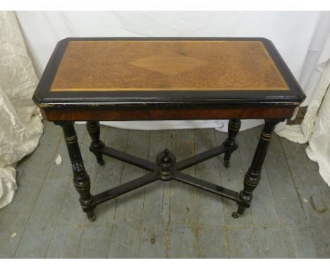 A Victorian rectangular card table on four turned legs with burr walnut insert to the top