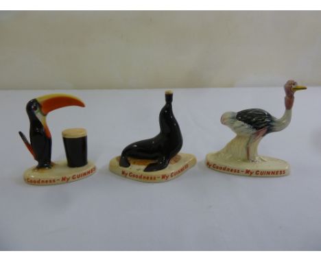 Three Carltonware advertising porcelain figurines selling Guinness to include a Toucan, a Seal and an Ostrich