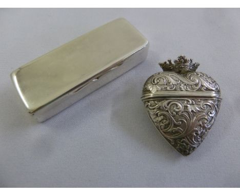A Victorian silver snuff box, plain rectangular with hinged cover circa 1850 and a Continental white metal heart shaped pill 