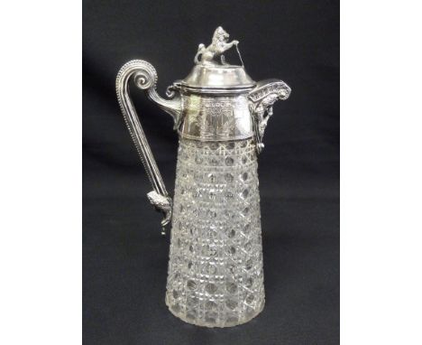 A Victorian hobnail cut glass claret jug with silver mounts and scroll handle, the hinged cover with lion finial, Sheffield 1