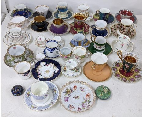 A collection of 19th century and later porcelain cabinet cups and saucers, together with two small cloisonne pill boxesLocati
