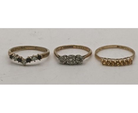 Three 9ct gold rings to include a 9ct platinum and diamond ring size K 1.6g together with a citrine band and one other total 