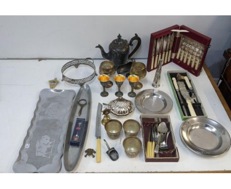 A collection of silver plated items, to include boxed flatware, a silver plated teapot, twin goblets, trays and other itemsLo