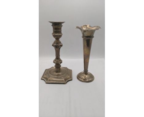 A silver weighted candlestick and vase, each engraved LocationIf there is no condition report shown, please request