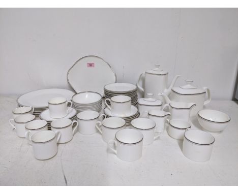 A Royal Doulton Platinum Concord pattern dinner service to include dinner plates, a coffee pot, teapot, coffee cans and sauce