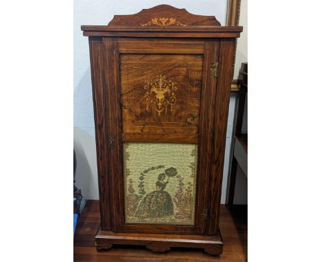 A late Victorian rosewood and marquetry inlaid cabinet, having a single door inset with a tapestry, 97h x 55wLocation:If ther