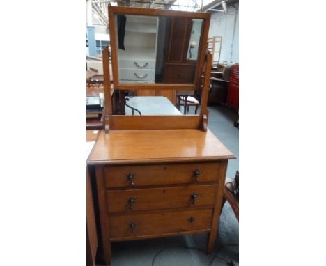 A dressing table with mirror and three drawers below 29 x 132 x 90