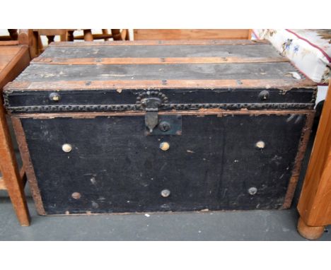 Vintage black travel trunk with wooden bracings and metal handles, 76 x 43 x 41 cmH