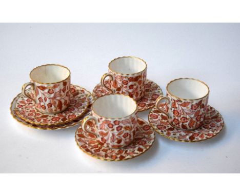 Four Copelands china coffee cans and saucers, pink floral pattern with gilt, with extra saucer in same pattern