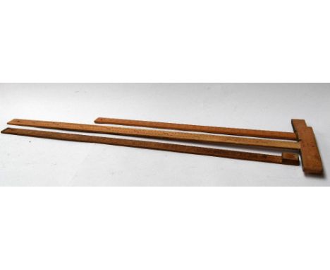 Three vintage wooden rulers