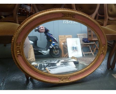 A large oval mirror 66cmD