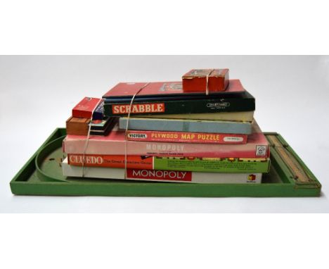 A collection of vintage boardgames including Scrable, Monopoly, and Cluedo, plus Bagatelle board with balls
