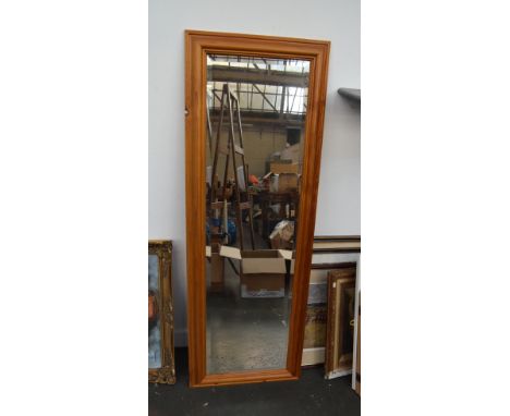 A pine dressing mirror with bevelled glass 135cmH x 48cm