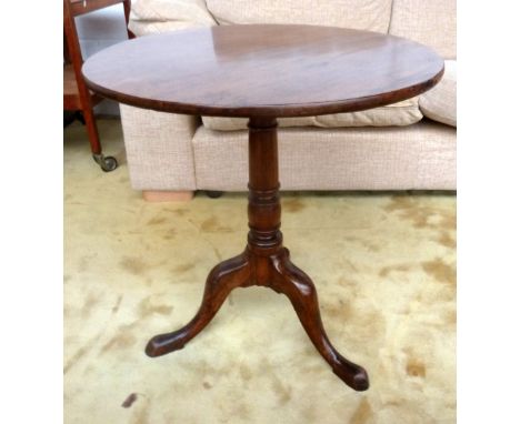 An early 19th century tripod table with baluster turned base