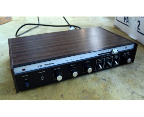 A Teletron solid state amplifier together with two speakers