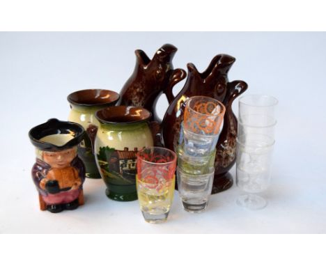 Two Cornish fish glug jugs together with a toby jug, two ceramic pots and shot glasses