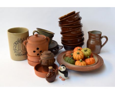 A large selection of earthenware ceramics including two teacups with saucers, several bowls/ramekins, a number of cermaic pum