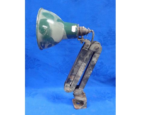 A 1950s INDUSTRIAL WORK LAMP with green enamel shade, and green painted bench fitting