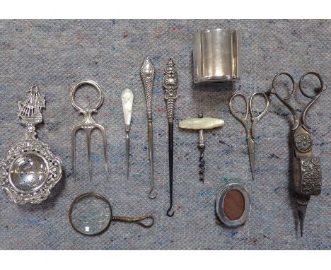 A PAIR OF VICTORIAN PLATED CANDLE SNUFFERS with other domestic items including button hooks, a Dutch tea strainer, a miniatur