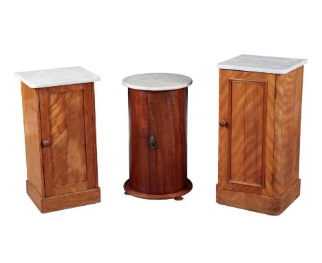 A VICTORIAN CYLINDRICAL MAHOGANY MARBLE TOPPED POT CUPBOARD and two other pot cupboards (one with bowed door panel)