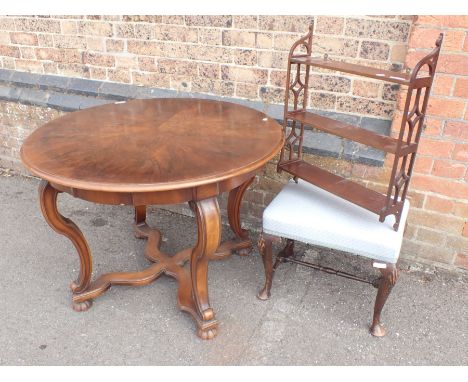 A CONTINENTAL WALNUT CENTRE TABLE labelled Emil Gerstel, Praha 90cm diam, a George I style stool, and a mahogany hanging shel