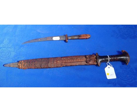 A TRIBAL SHAPED BLADE WITH LEATHER HANDLE with a leather scabbard (end missing) and another afro-Persian style knife