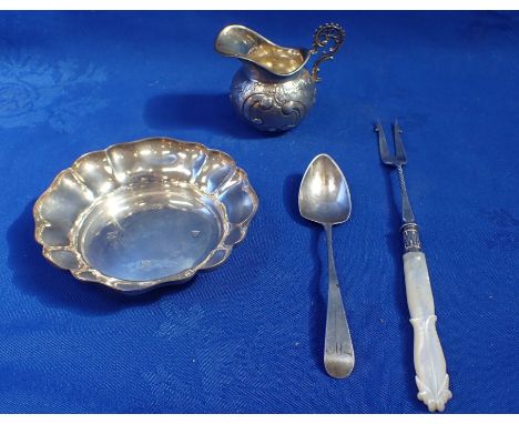 A MOTHER OF PEARL HANDLED SILVER PICKLE FORK together with a silver dish, a Georgian silver tea spoon and a silver cream jug 