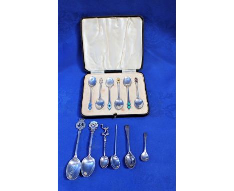 A SET OF SIX SILVER AND ENAMEL TEASPOONS (boxed) together with six other similar silver teaspoons 