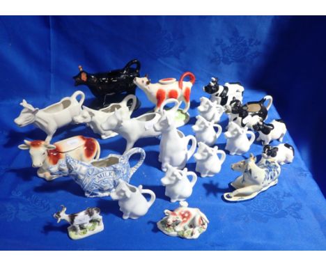 A COLLECTION OF CERAMIC COW CREAMERS various styles and dates