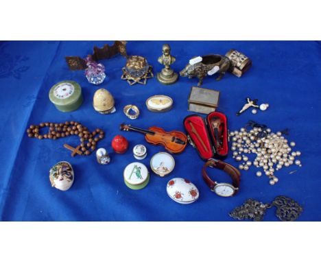 A PORCINE PIN CUSHION with other bibelots, including enamel and ceramic boxes, glass and other items