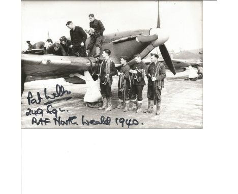 Pat Wells 249 Sqn Battle of Britain pilot signed 6 x 4 photo of the ground crew loading ammunition on to his plane. Good Cond