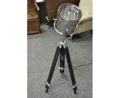 An Art Deco style signal lamp, stainless steel case, black adjustable tripod stand, foot pedal switch