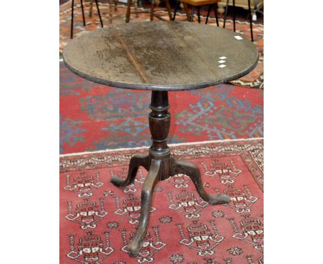 A George III oak and mahogany tilt top tripod table, c.1800