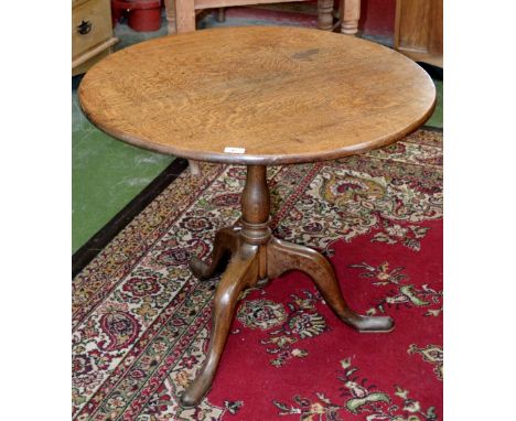 A George III oak tilt top tripod table