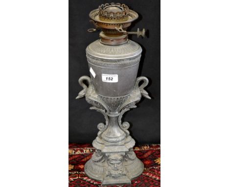 A Victorian oil lamp, circular reservoir, gadrooned edge, swags to base, c.1890