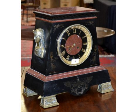 An Egyptian Revival  rouge and belge noir mantel clock, the 18cm dial with black chapter ring, gilt Roman numerals, rouge mar
