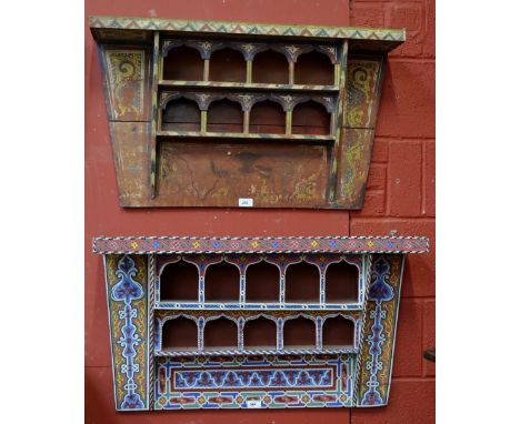 A pair of North African wall shelf in the Moorish taste, arched alcoves and geometric designs throughout.