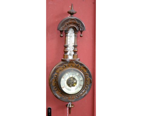 A Victorian mahogany wall hanging barometer/thermometer, carved case, arched top