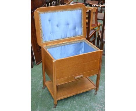 A large Jonell light oak work box, hinged cover, single drawer, undertier and casters, circa 1950.