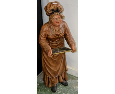 Advertising - a novelty floor standing mannequin, modelled as a lady baker in mop cap, holding a chalk board menu, 100cm high