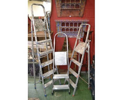 Three sets of aluminium step ladders