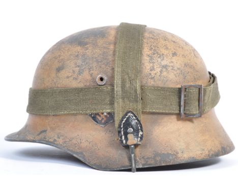 A good reenactment / replica WWII Second World War Third Reich Nazi German M40 Afrikakorps / desert steel camouflage helmet. 