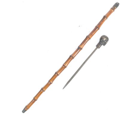 An interesting antique 19th century Victorian sword stick / walking stick cane with a concealed stiletto blade. The brass kno
