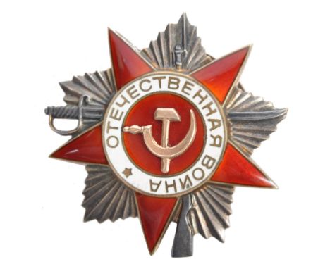 An original Soviet Russian Order Of The Patriotic War medal (Second Class). Red and white enamel with central hammer and sick