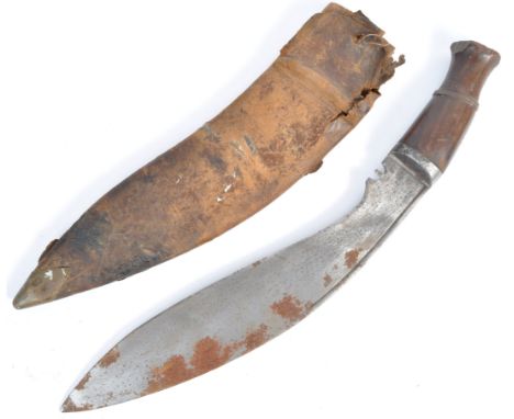 An original WWII Second World War Gurkha Kukri knife. The traditional Nepalese machete has a wooden pommel and handle with a 