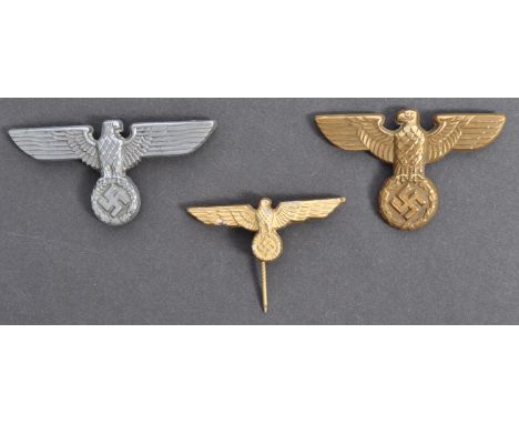 A collection of x3 original WWII Second World War Nazi&nbsp;Party Third Reich metal cap badges and eagle lapel stick pin. The